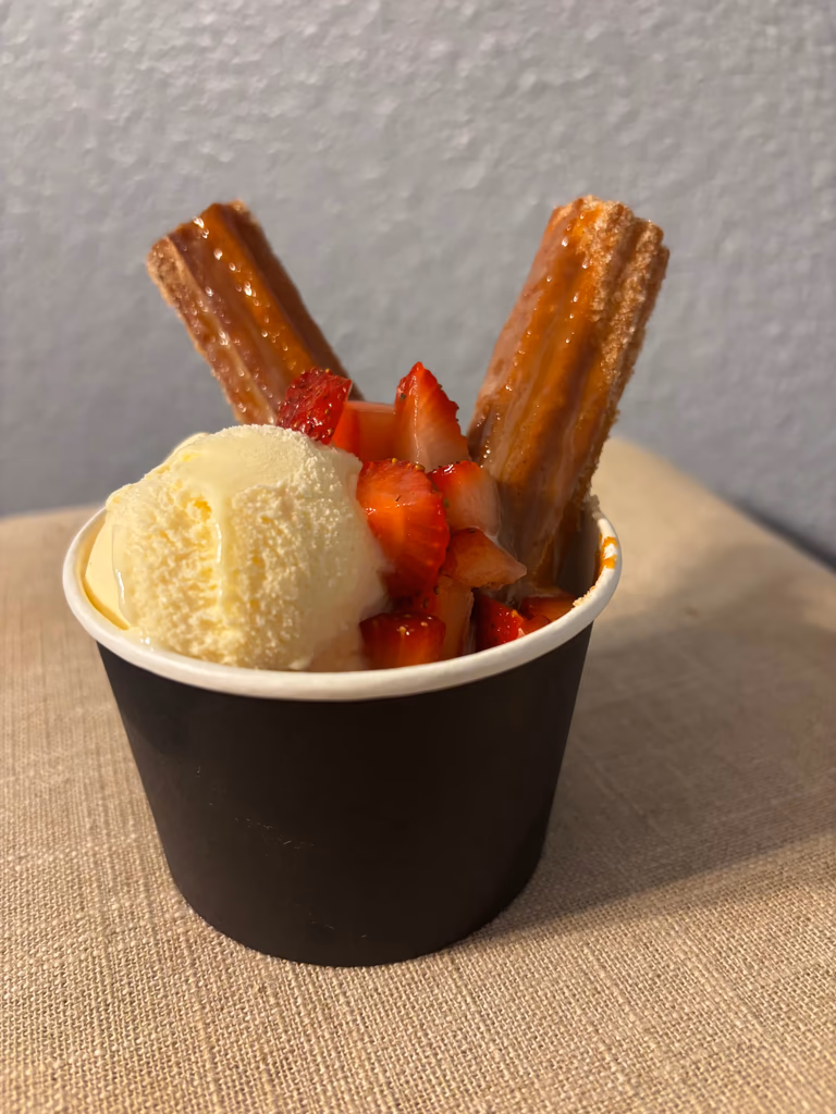 Churro sundae with vanilla ice cream and strawberries